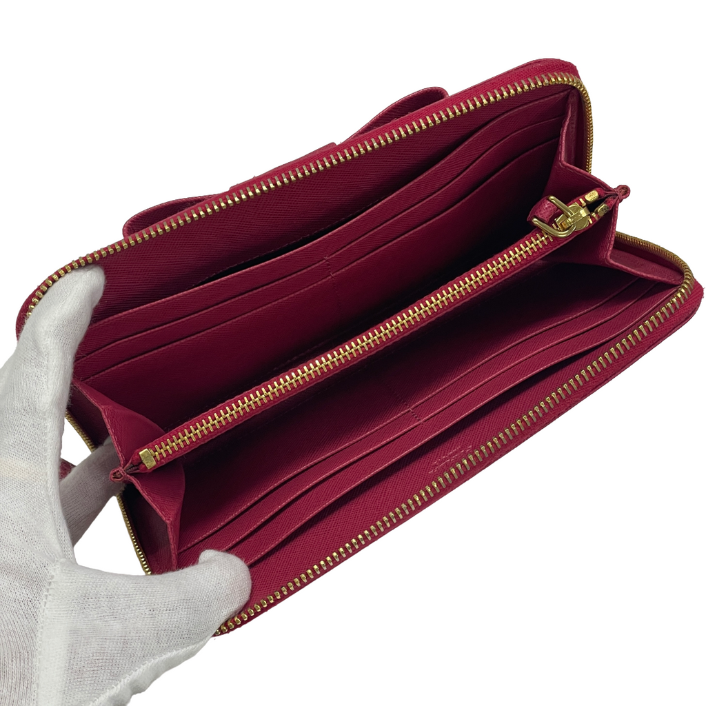 PRADA プラダ リボンモチーフ サフィアーノ ラウンドファスナー長財布 ピンク レイーディス 中古